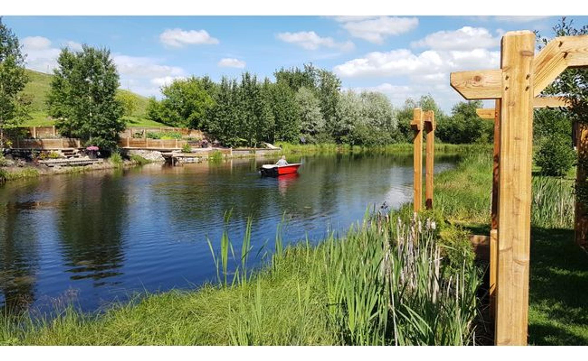 Clear water in Dick's pond, aerated by a Koenders windmill