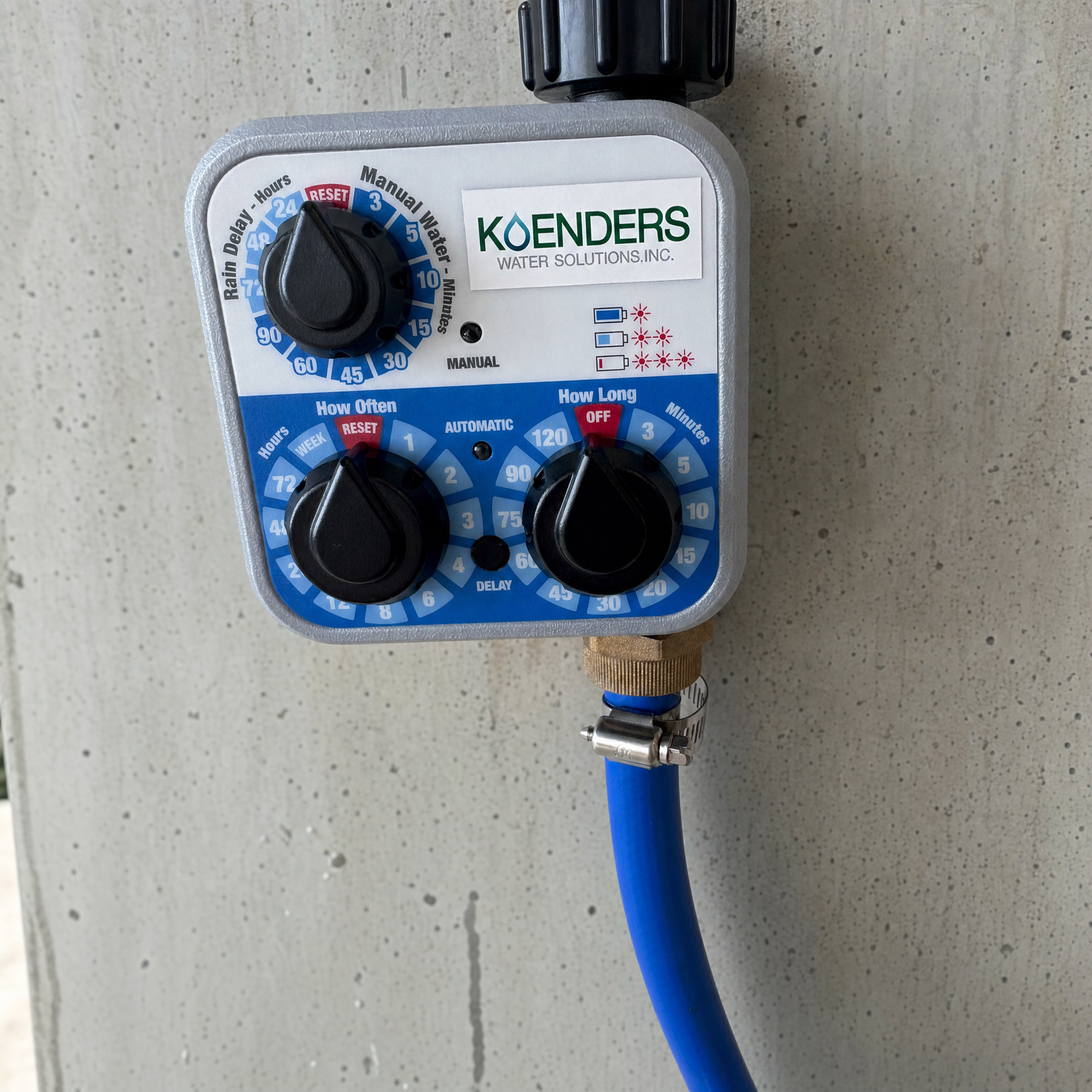 Koenders battery-powered water dispensing controller mounted on a wall, with How Often and How Long dials