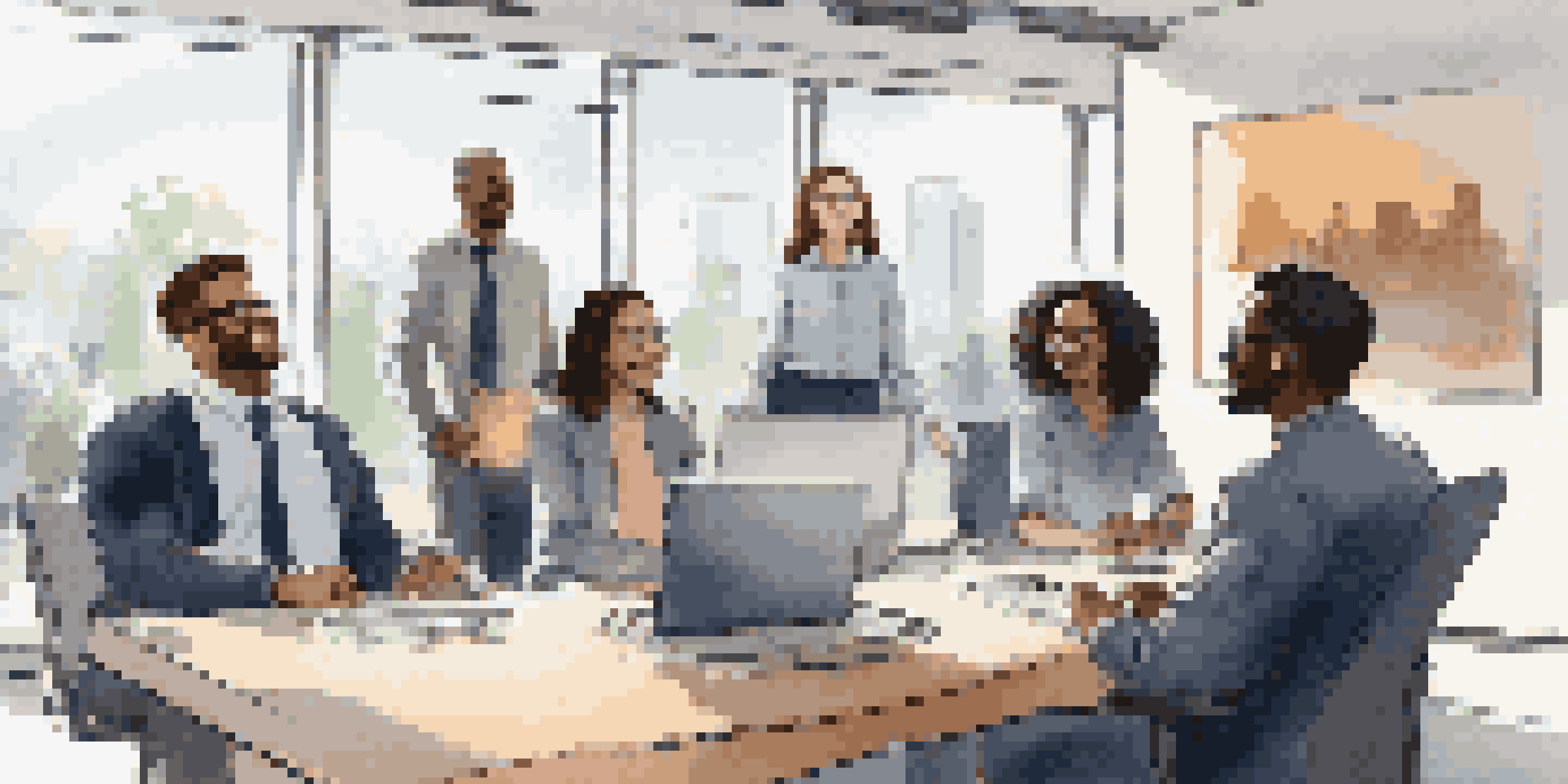 A diverse group of individuals participating in a virtual meeting on a video call, showcasing a professional and engaging atmosphere.