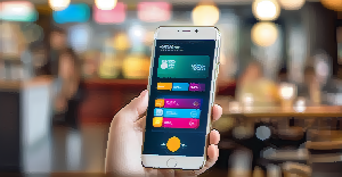 A smartphone displaying a colorful digital wallet app interface in a café setting.