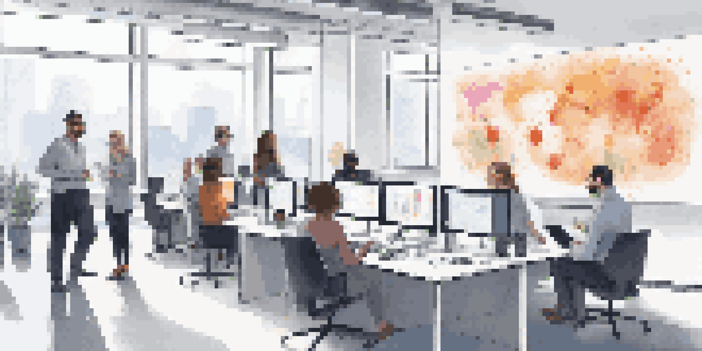 A diverse team of data scientists collaborating around a large screen displaying data visualizations in a bright modern office.