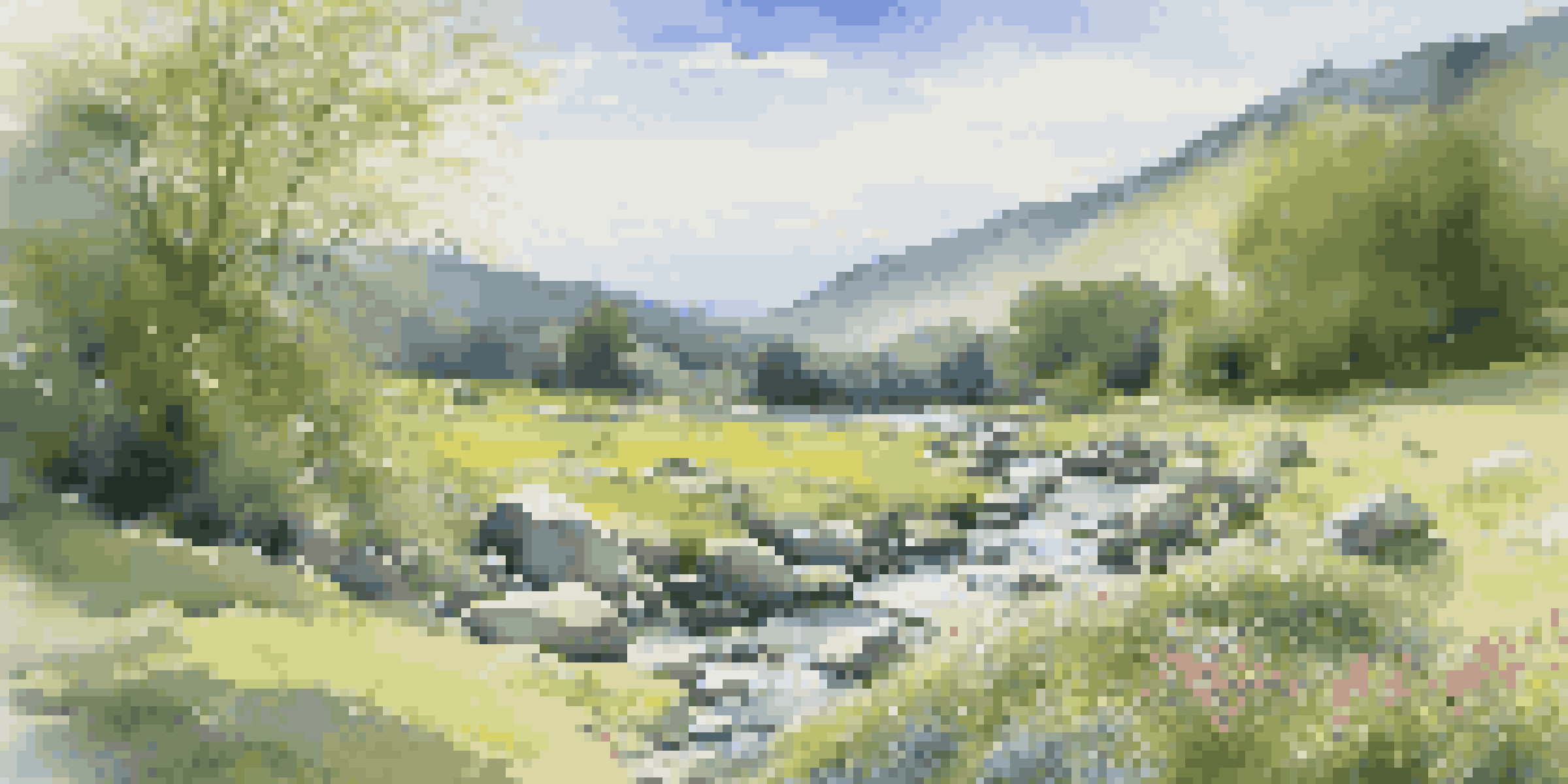 A peaceful valley with a stream, wildflowers, and a clear blue sky filled with clouds.