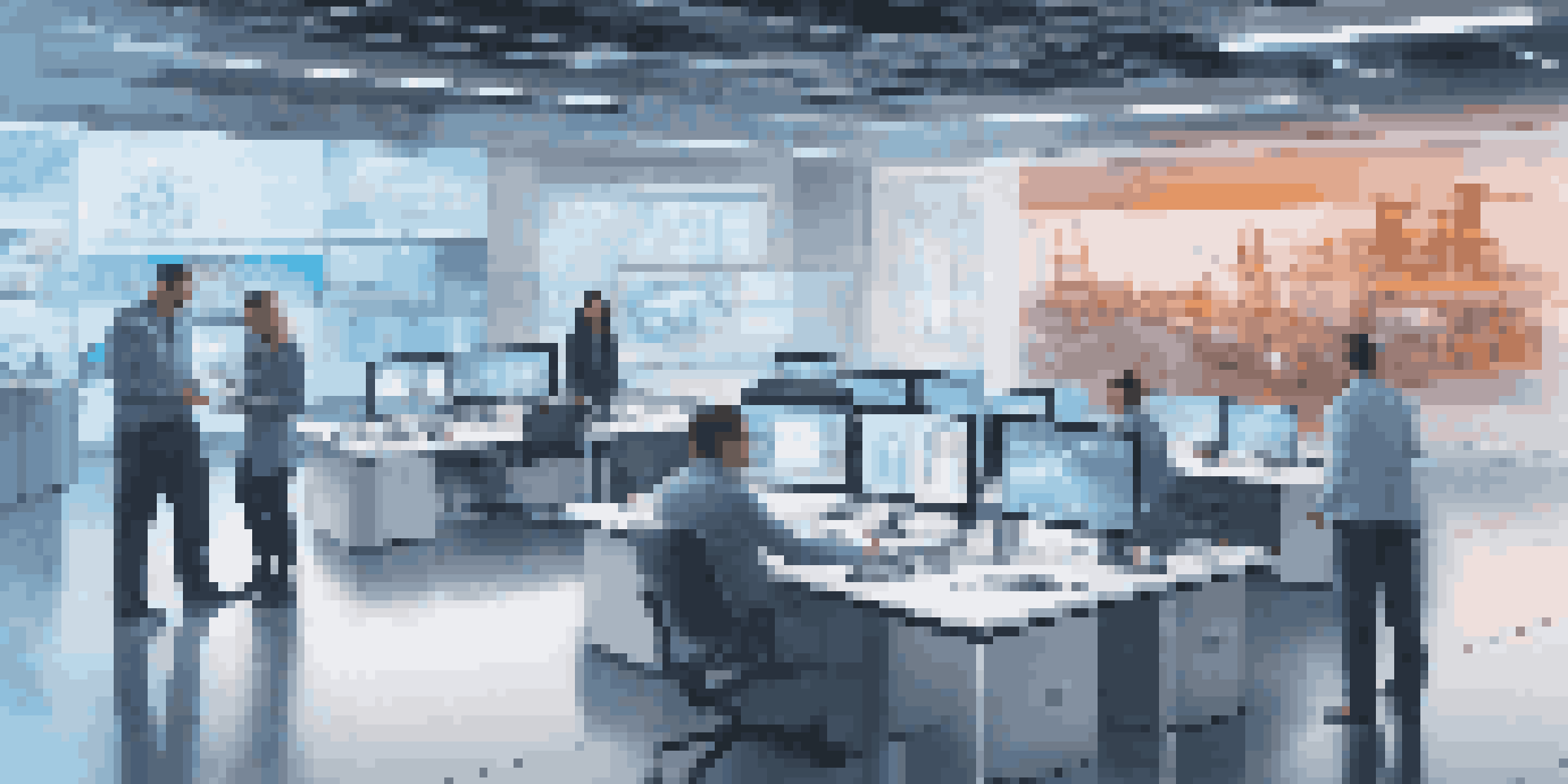 A modern office with a 3D holographic model of a manufacturing plant displayed in the center, surrounded by engaged employees and digital screens showing data.