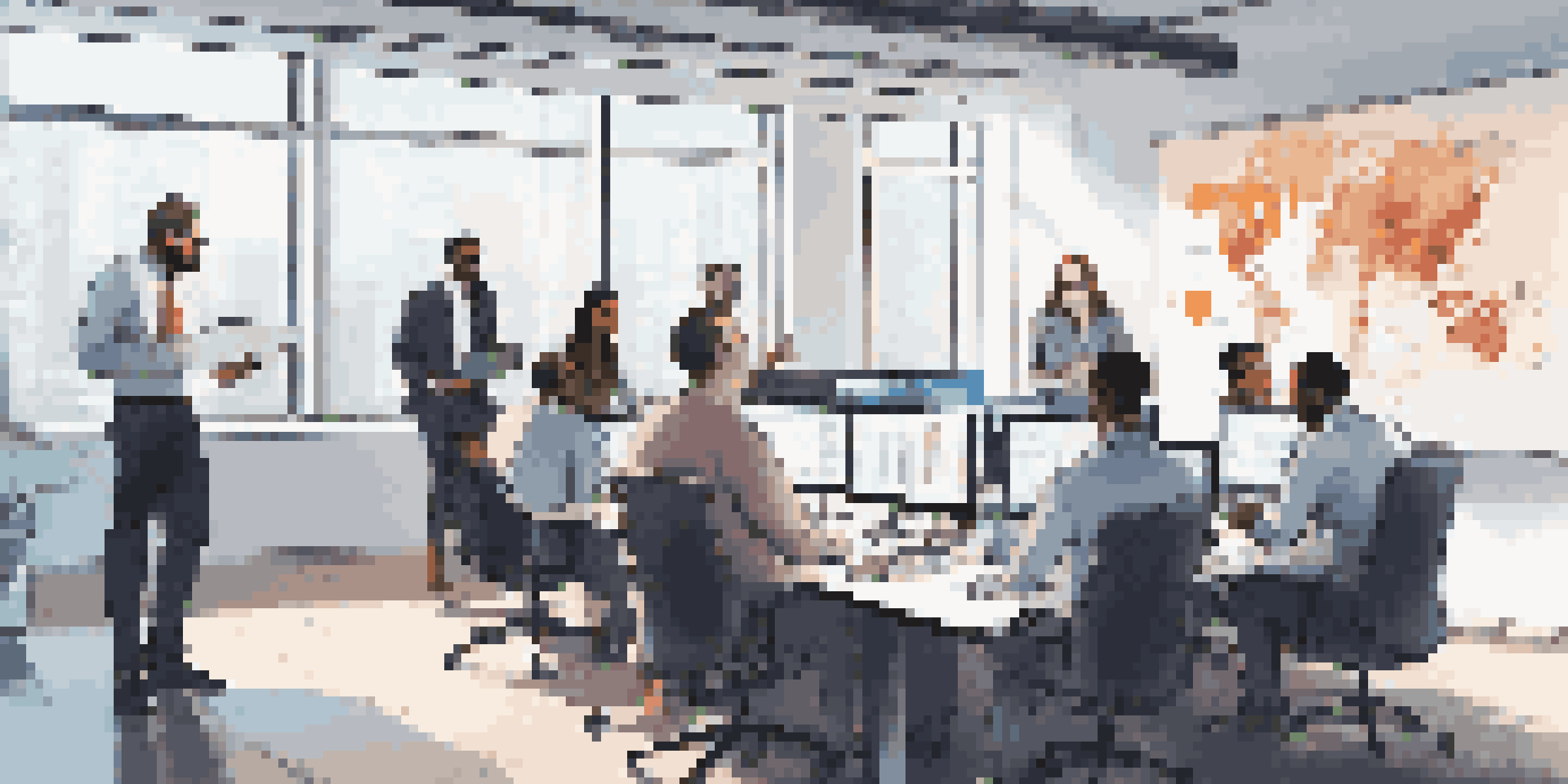 A diverse group of IT professionals collaborating on a cybersecurity incident response plan in a bright conference room.