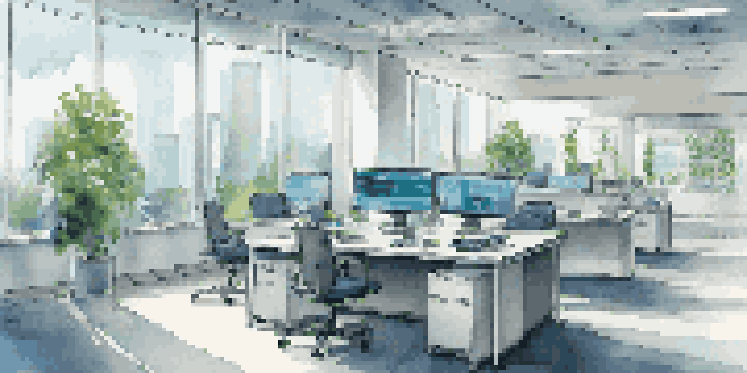 A modern financial office with multiple monitors showing data analytics and natural light from large windows.