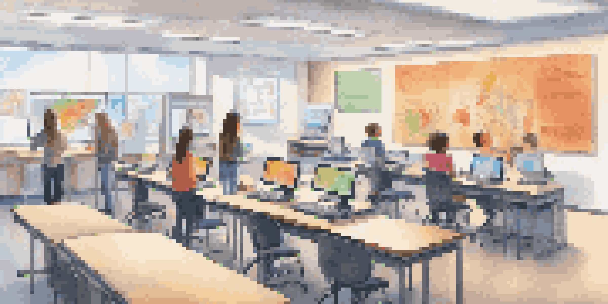 A modern classroom with diverse students using biometric devices to access computers.