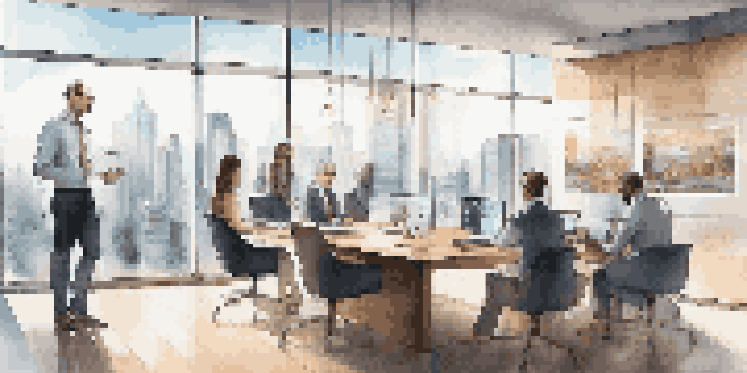 A contemporary office setting with real estate professionals having a meeting, surrounded by glass walls and city views.