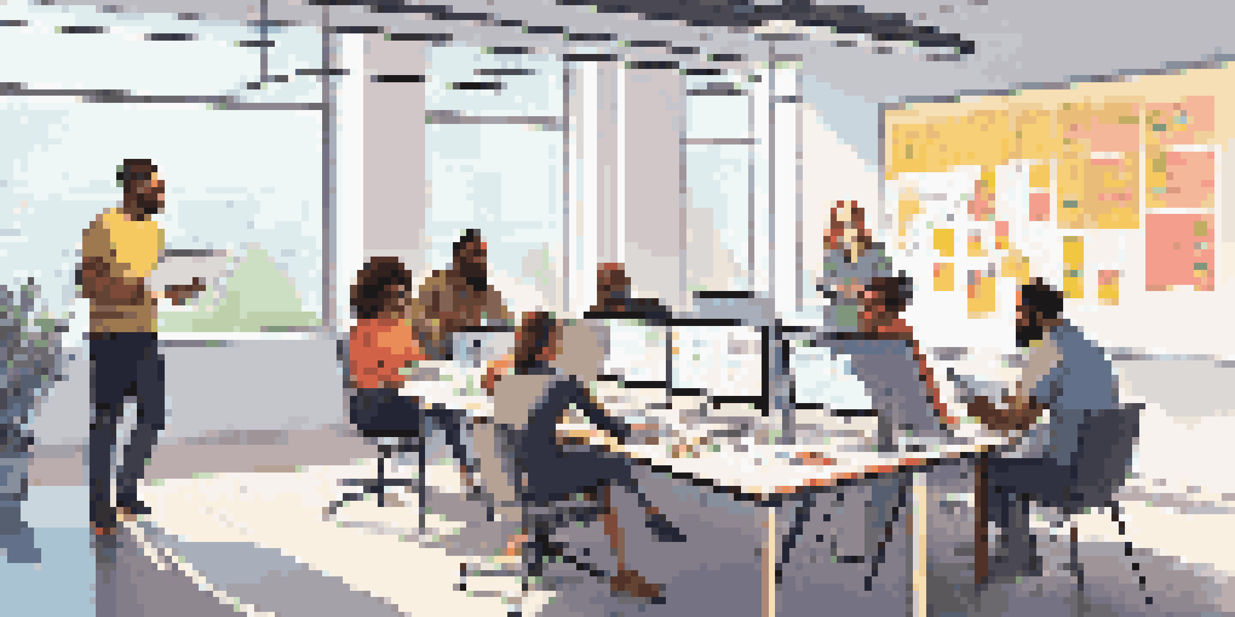 A diverse group of team members collaborating in a bright office space with a digital project board and a whiteboard filled with diagrams.