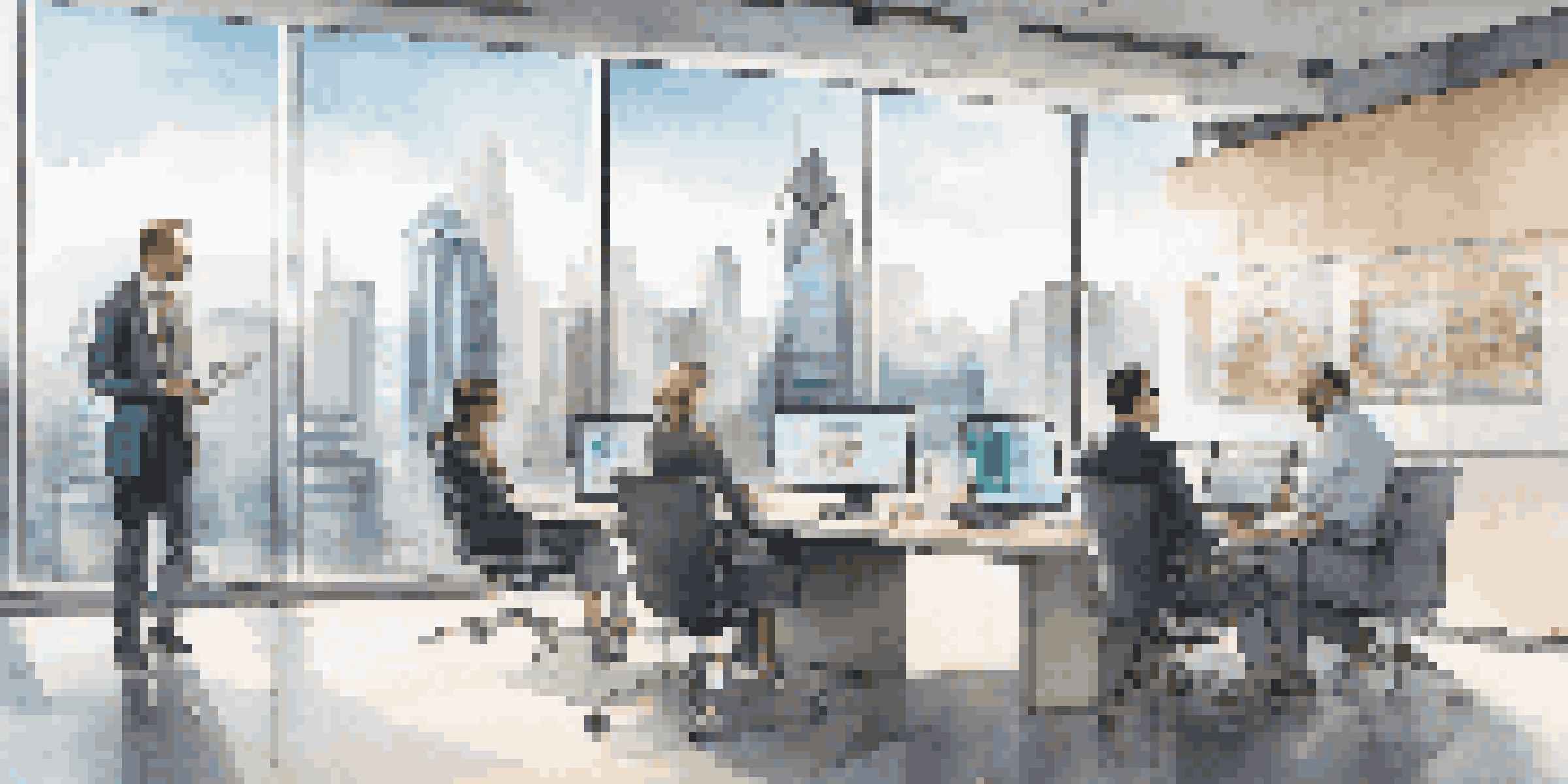 A modern office with a screen showing an AI chatbot interface, professionals discussing around a table with laptops.