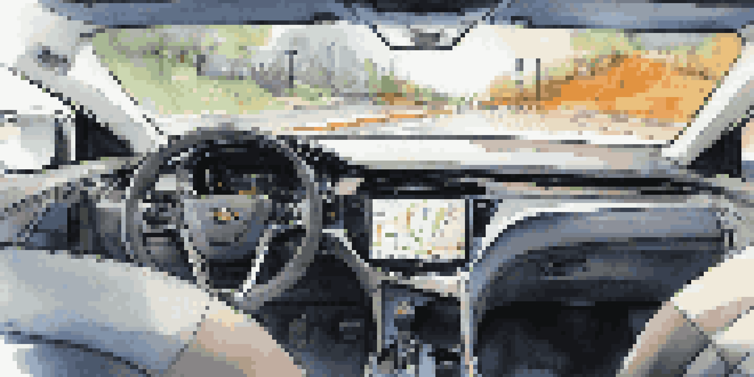 A modern car dashboard featuring a telematics interface with real-time data, including GPS navigation and fuel efficiency statistics.
