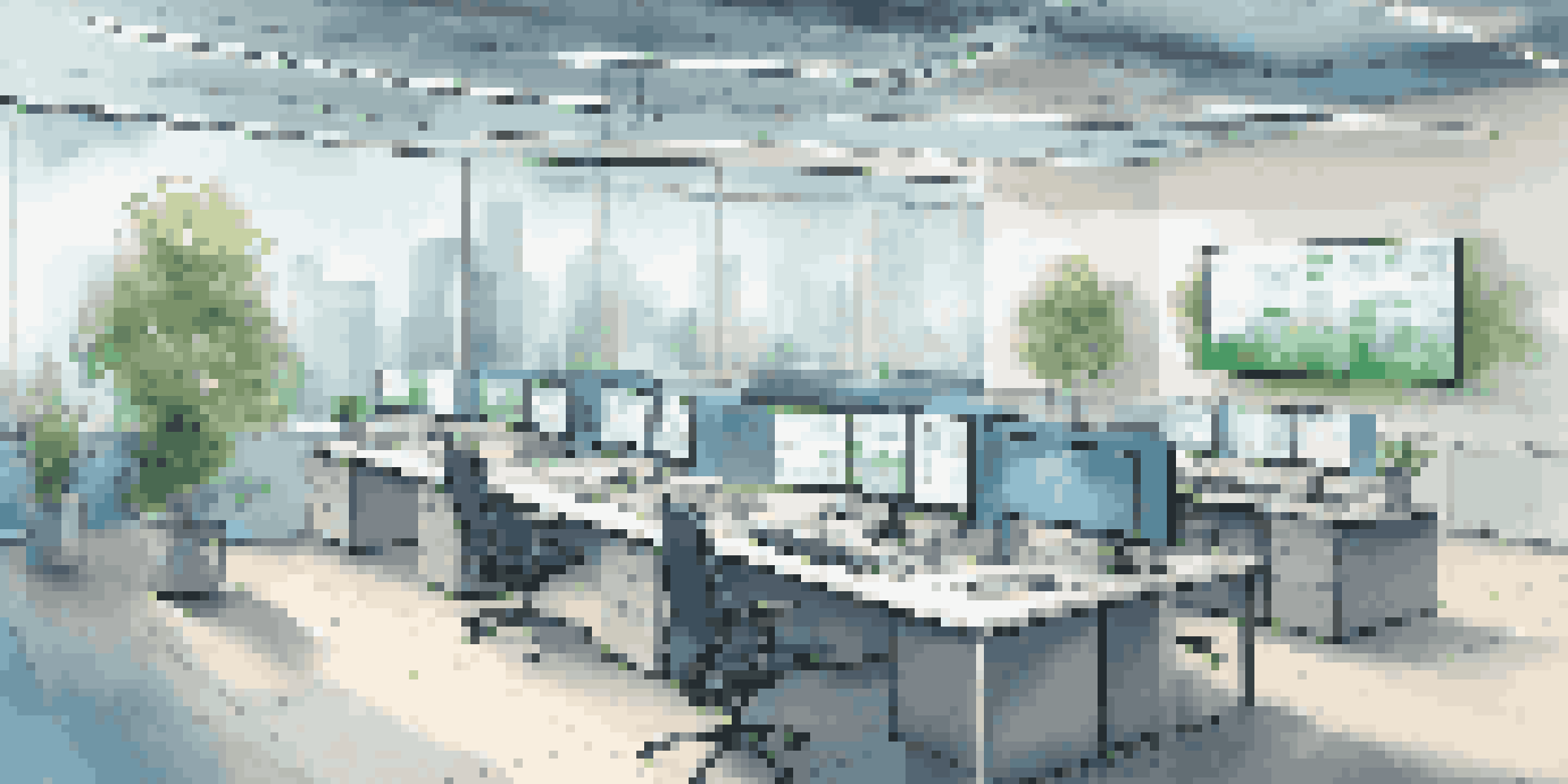 An office space featuring multiple screens illustrating hybrid cloud technology, with modern furniture and natural light.