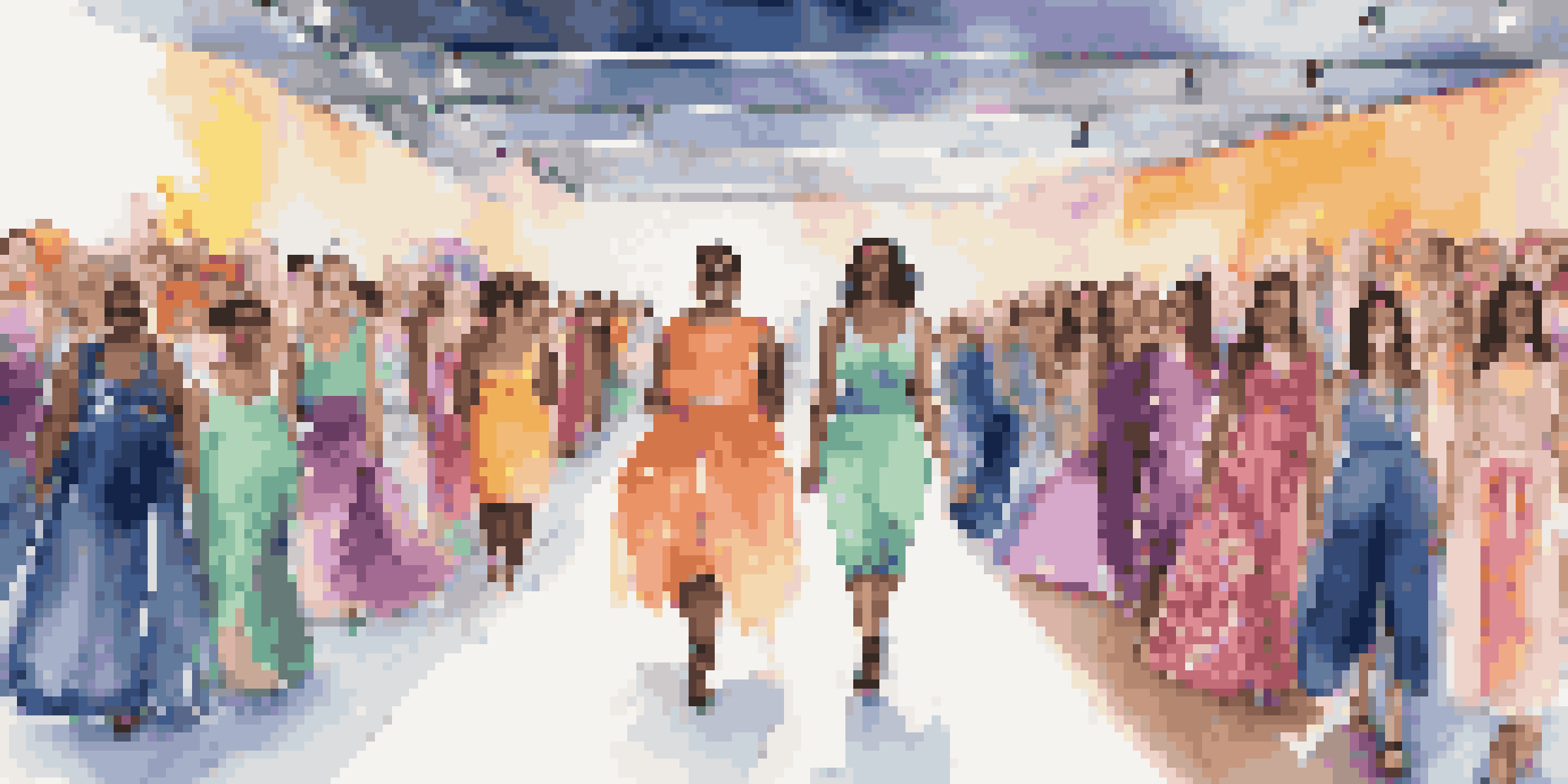 A fashion runway with diverse models wearing adaptive clothing, featuring colorful lights and an enthusiastic audience.