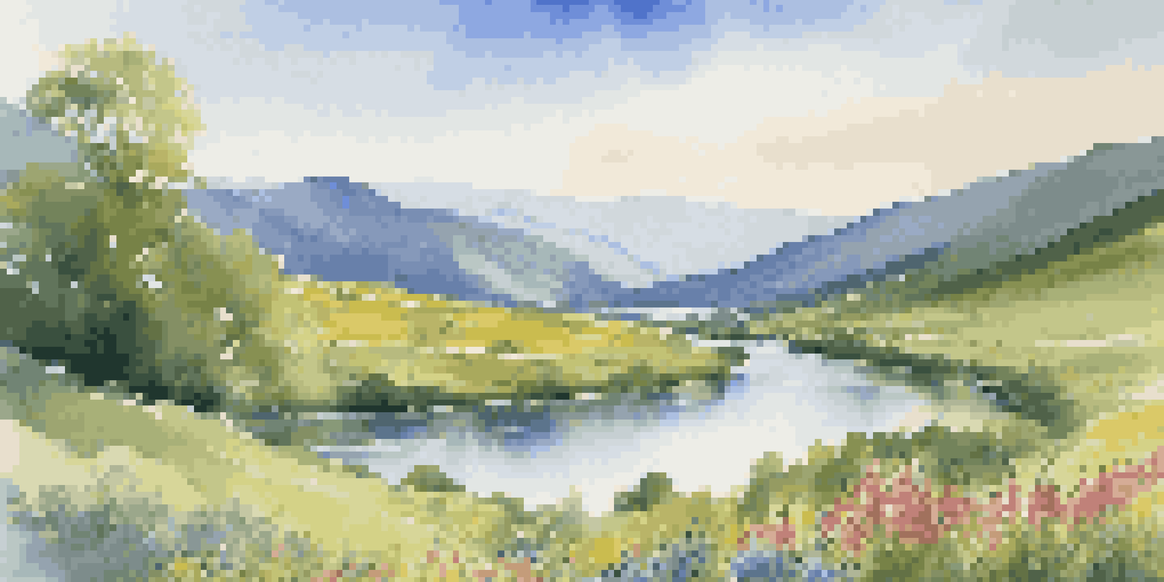 A beautiful landscape with a winding river, green valley, and mountains under a clear blue sky.