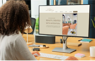 woman looking at cutom designed website