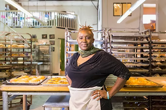 woman standing in her small business