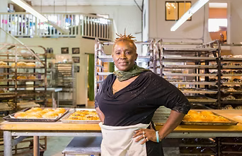 woman standing in her small business