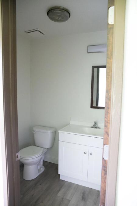 Half bathroom in bedroom