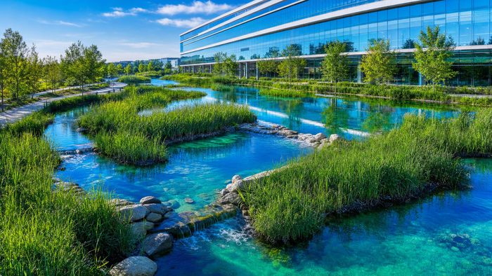 Showcase a real-world example of extensive biological water filtration operating beside civic architecture.