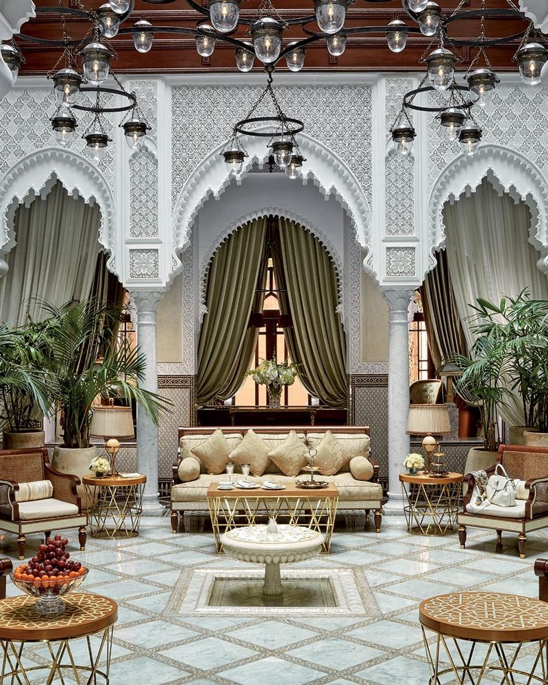 The ornate white atrium salon with horseshoe arches and a fountain