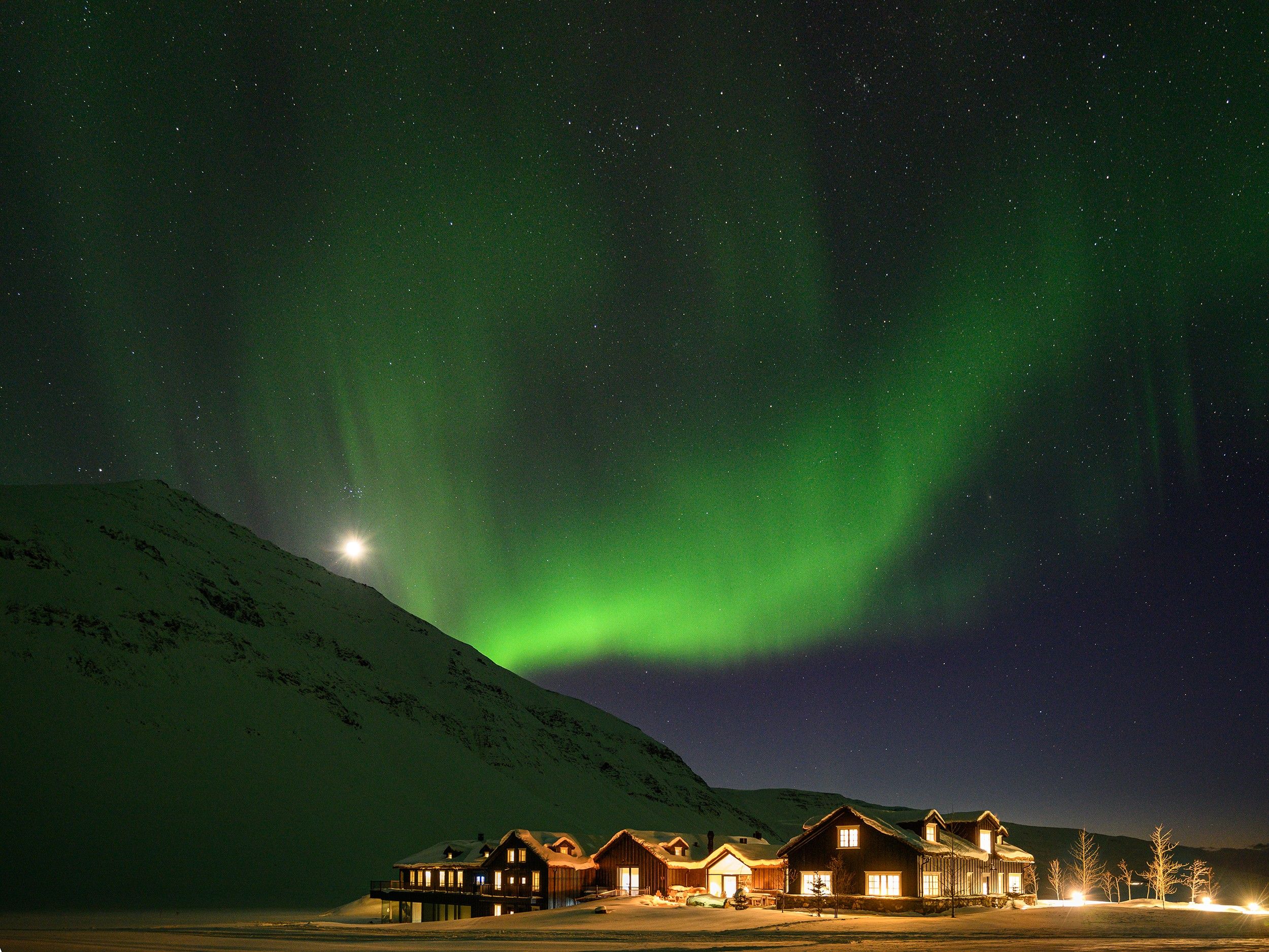The northern lights over Deplar Farm, Troll Peninsula, Iceland