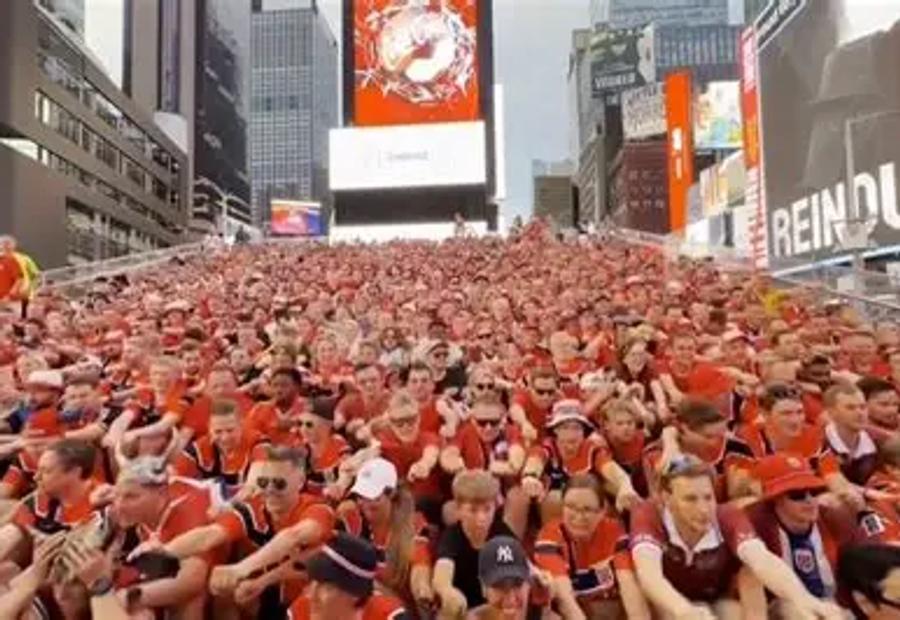 Norway fans performing their famous row chant in Times Square New York