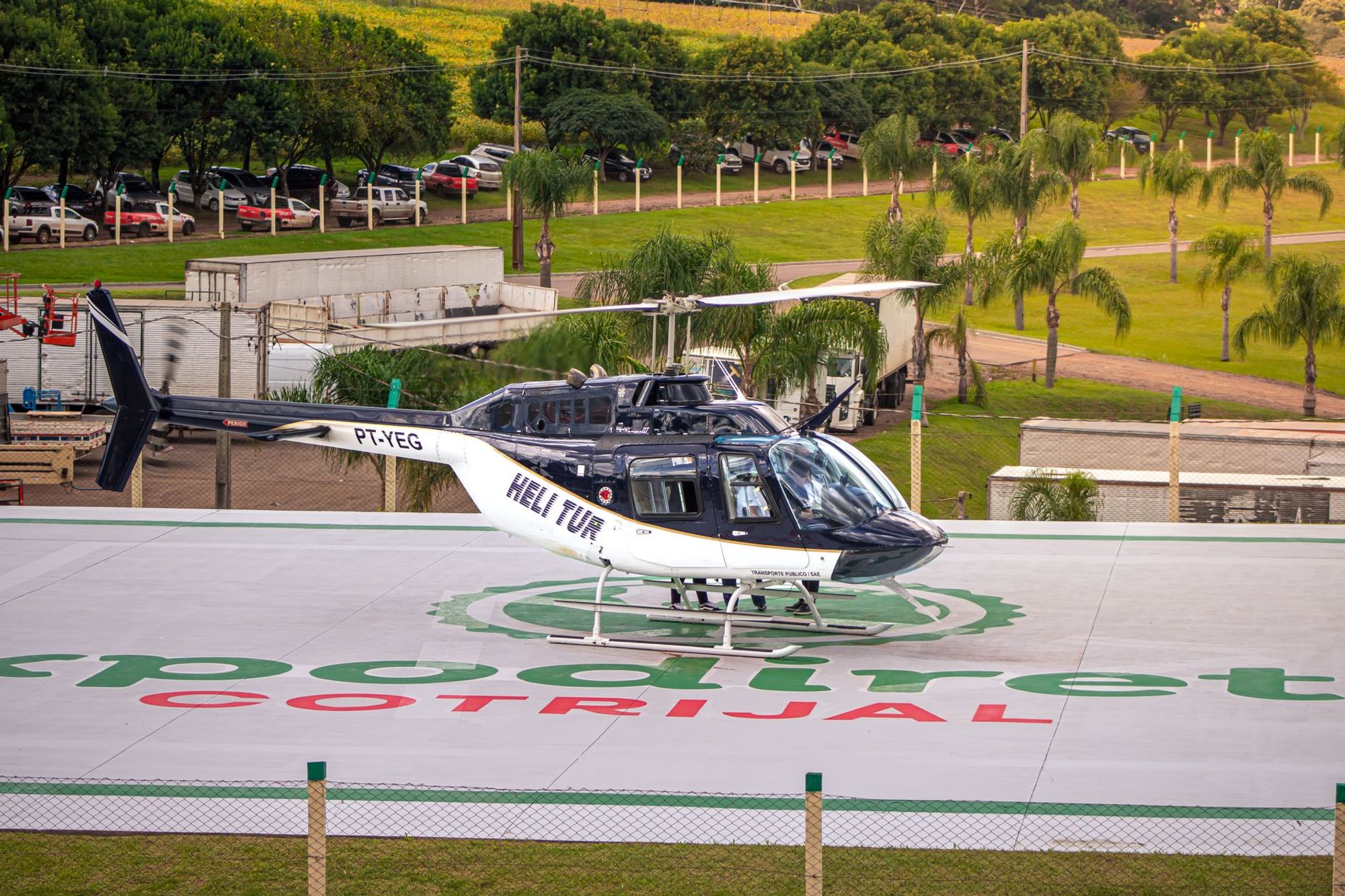 Helicopter parked on a marked landing pad