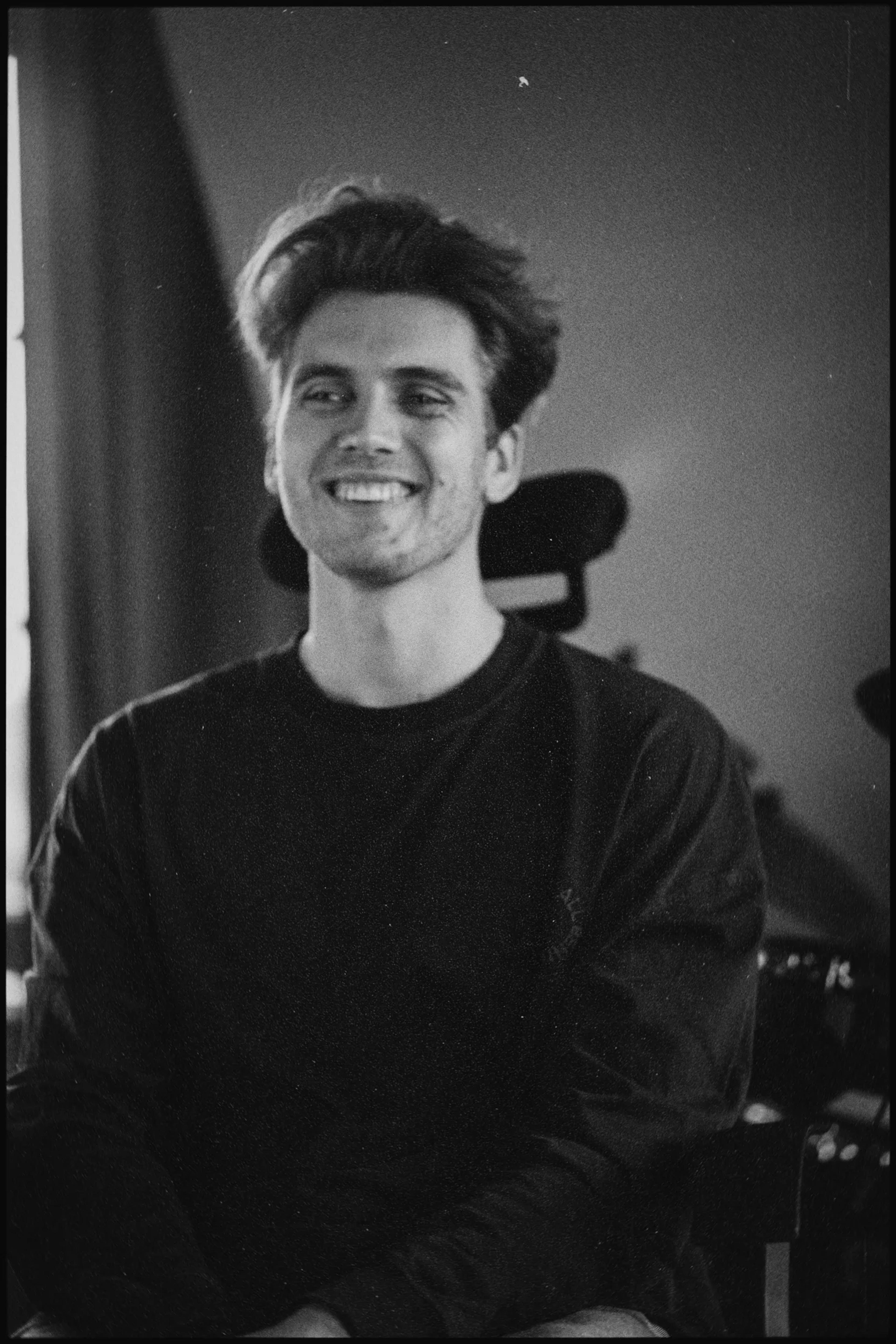 Emil Dellert, smiling, in his studio