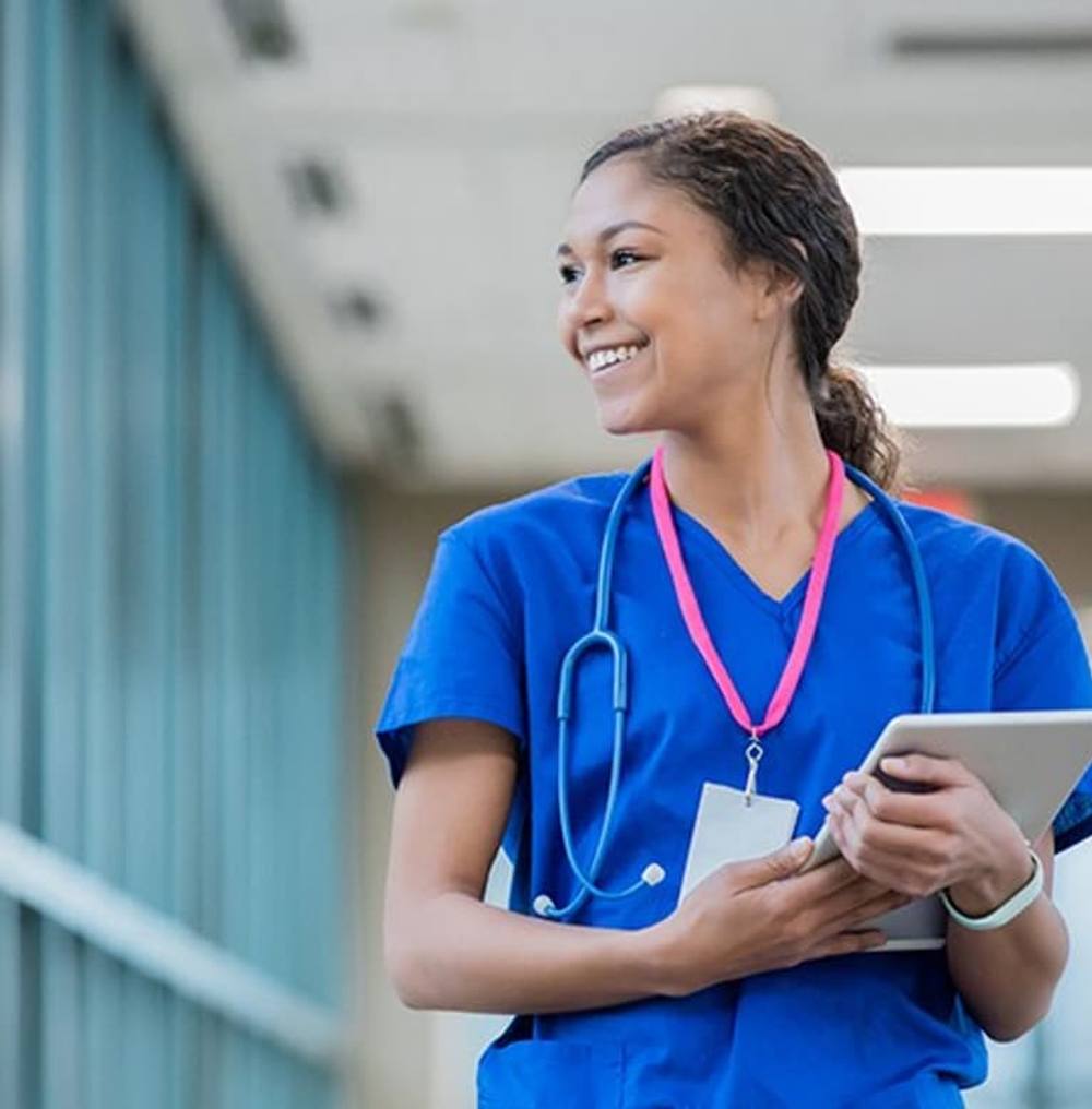 Travel nurse in blue scrubs