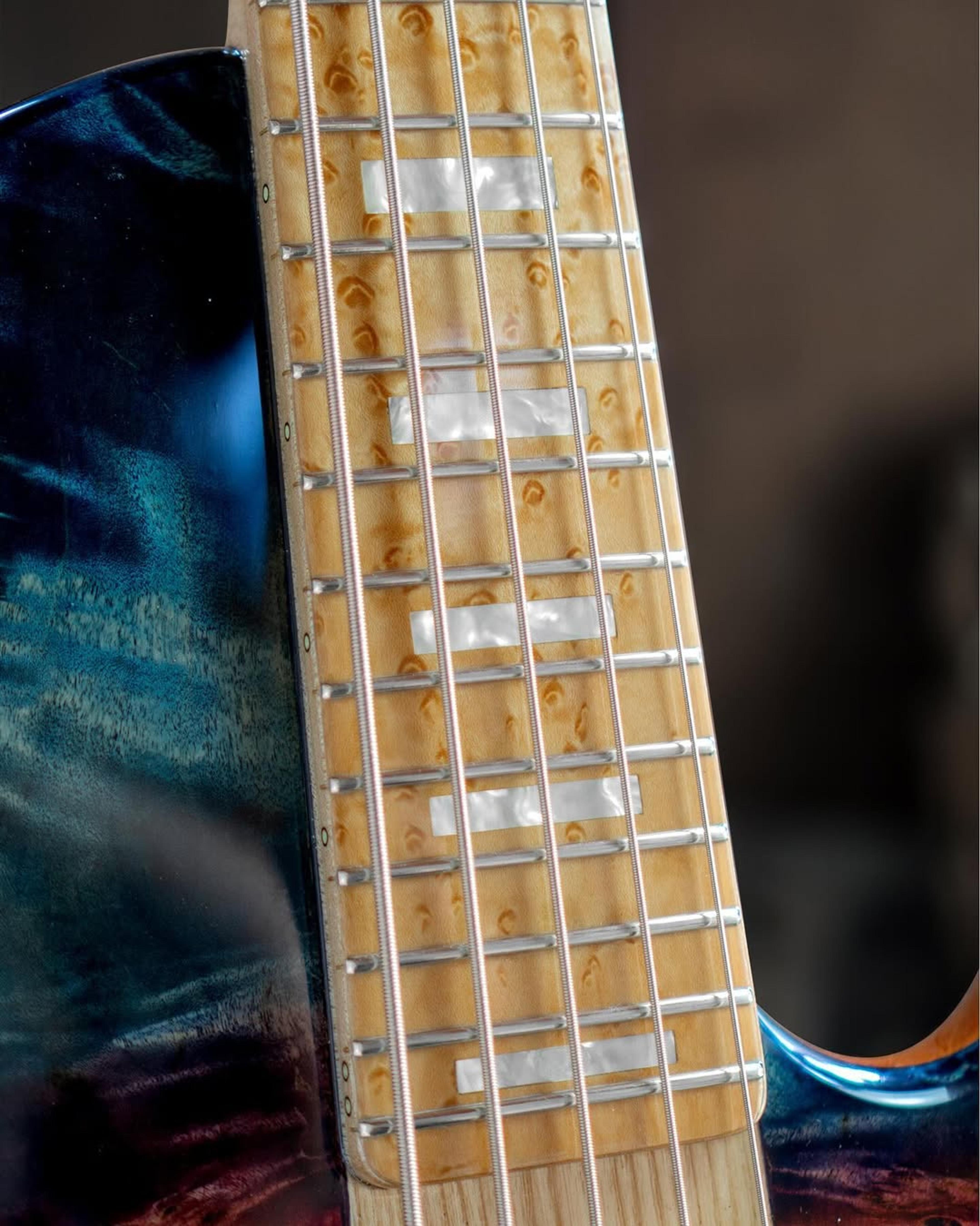 Front detail fretboard view of the ODIENG Nebula 5 string bass