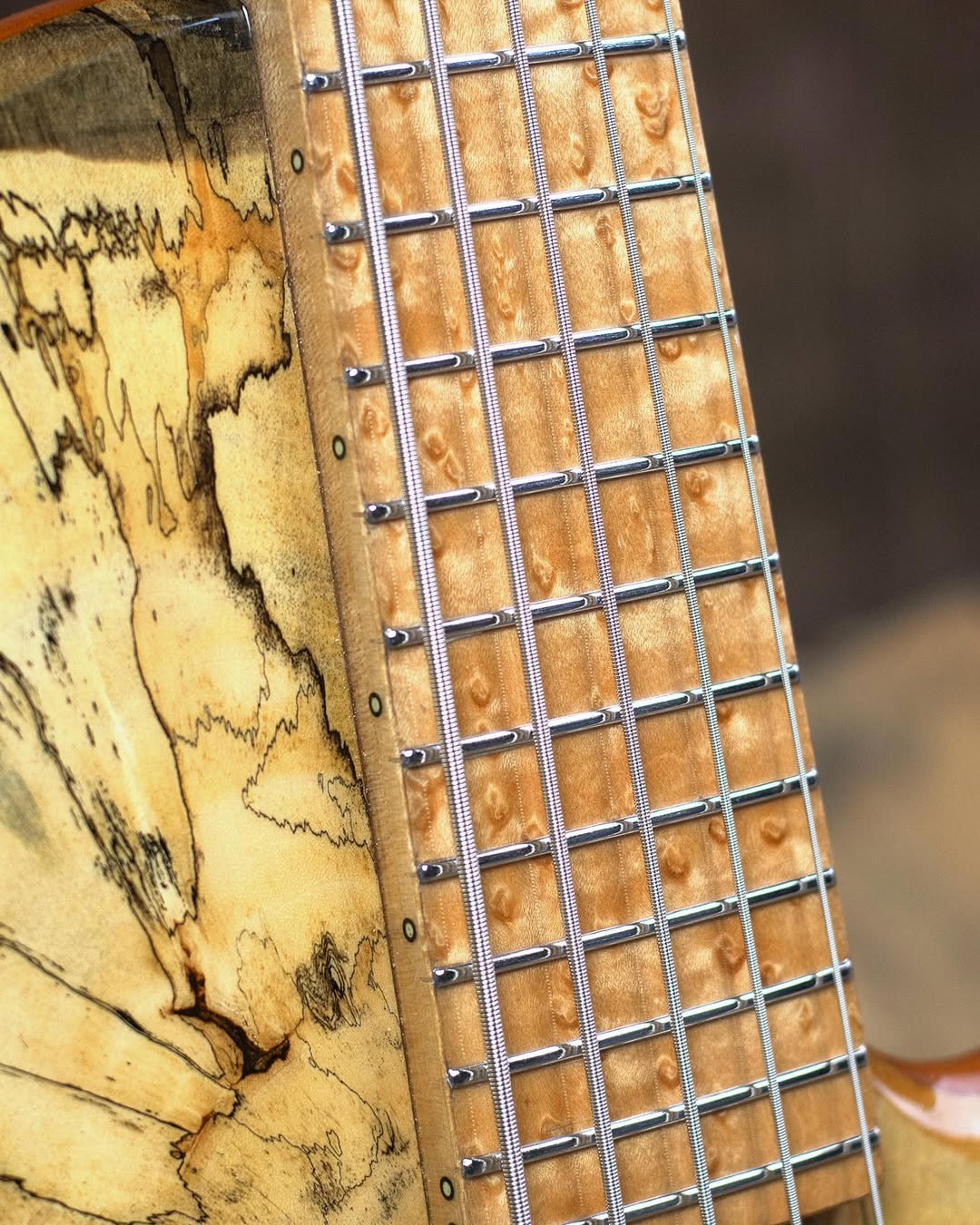 Front detail fretboard view of the ODIENG Nebula 5 string bass