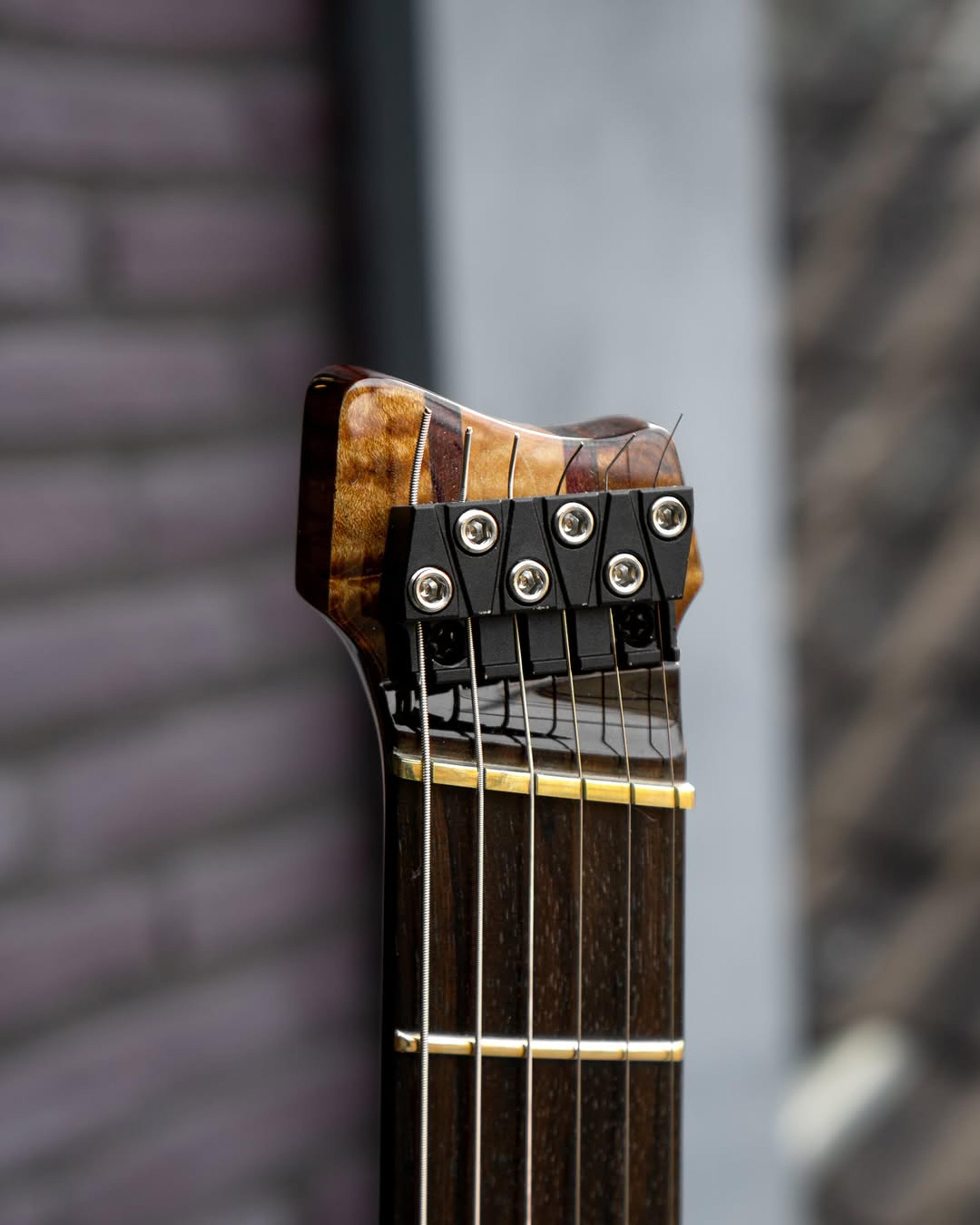 Front Headstock view of the ODIENG PA-HL Healess 6 String Guitar