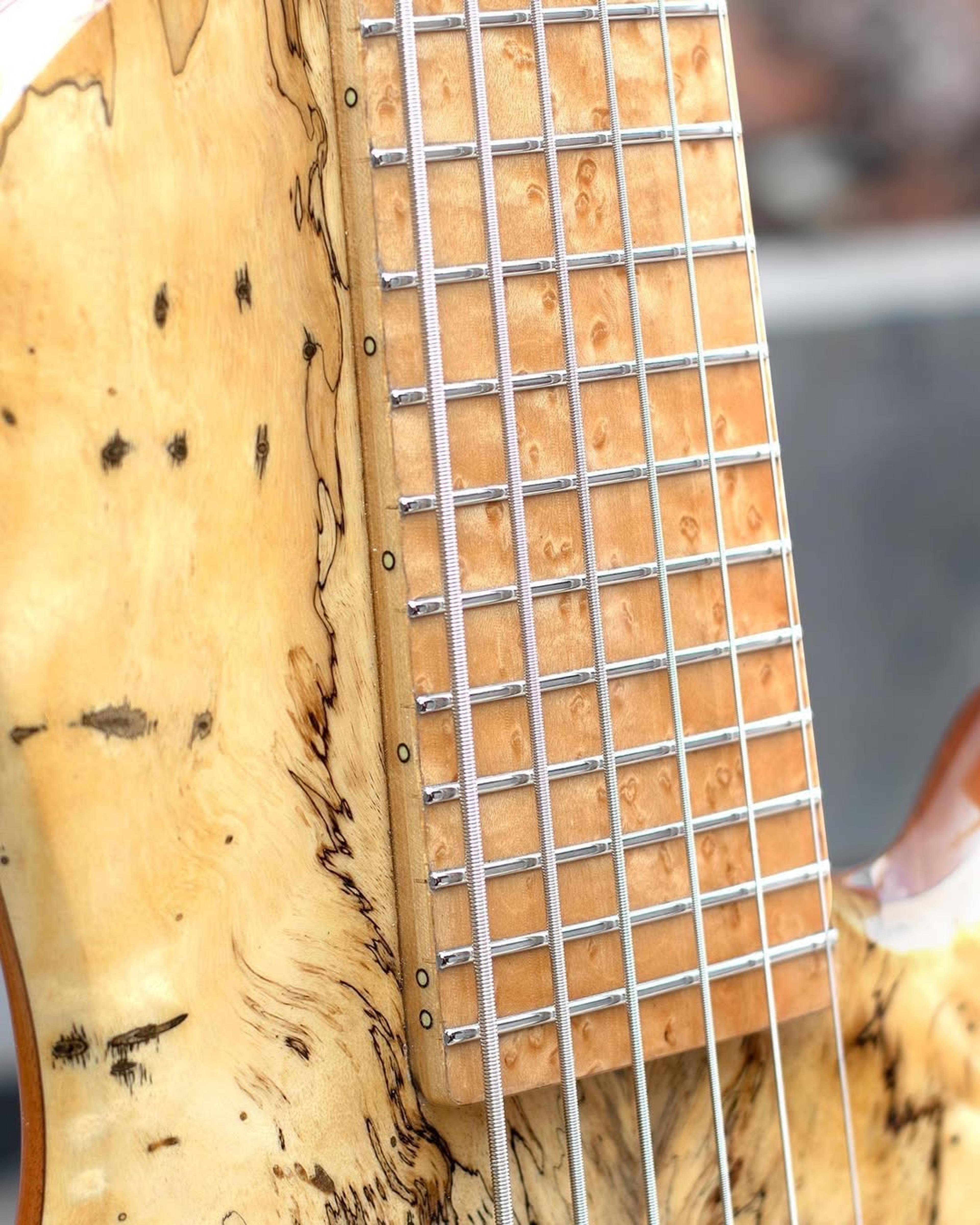 Front detail fretboard view of the ODIENG Nebula 6 string bass