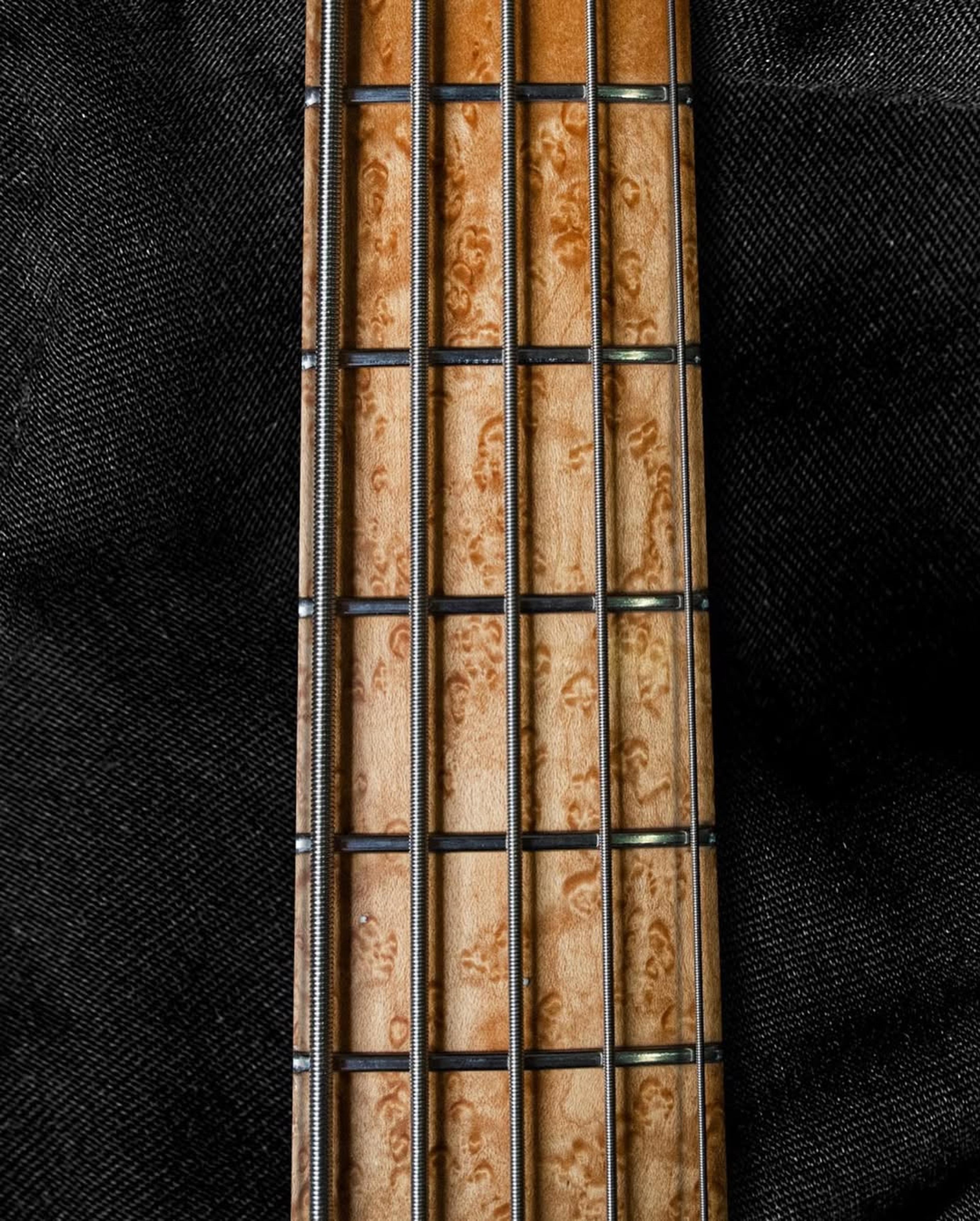 Front detail fretboard view of the ODIENG Nebula 5 string bass