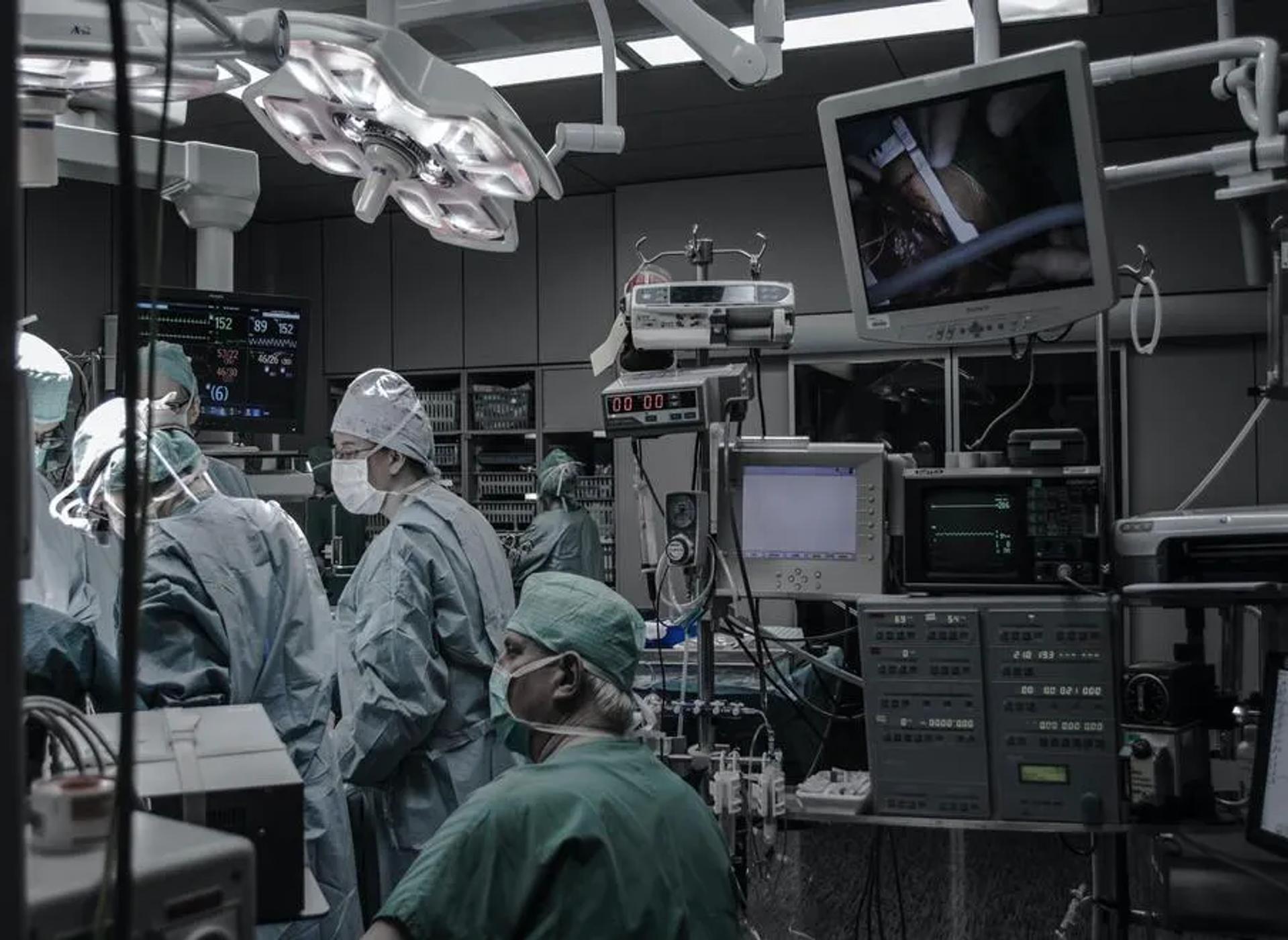 Doctors and nurses working an operating room