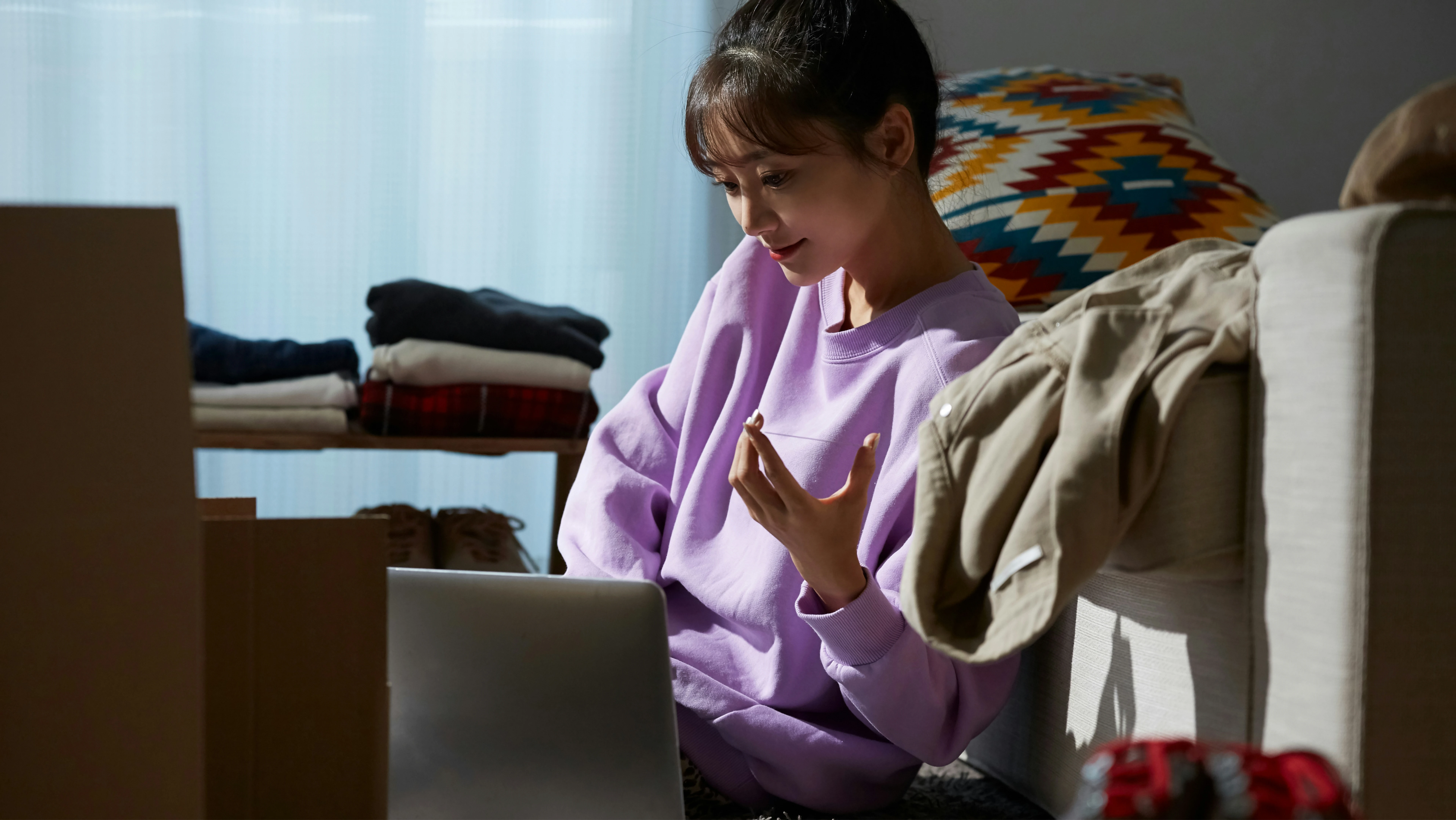 Woman looking at laptop