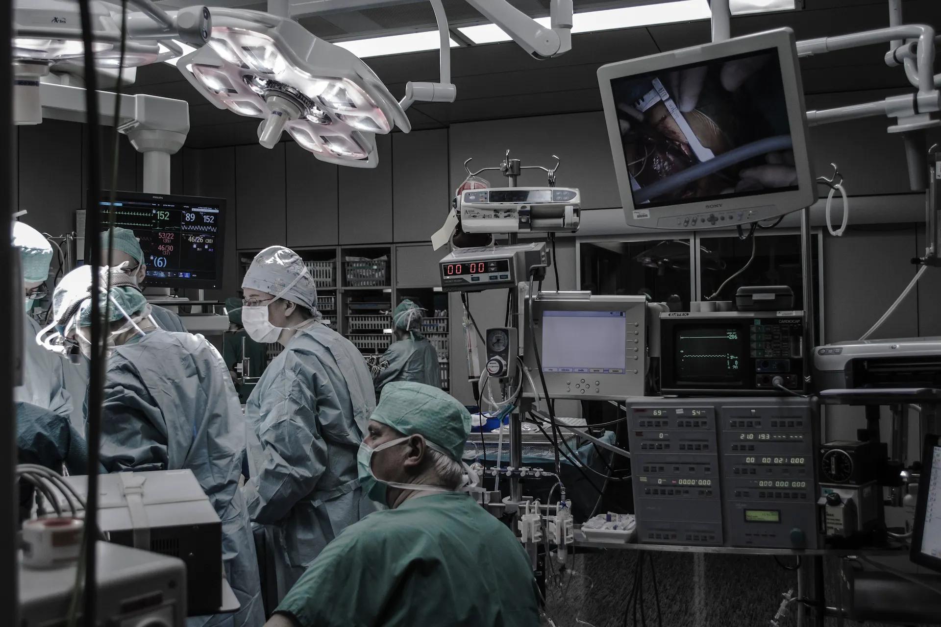 Doctors and nurses working in a surgical operation room