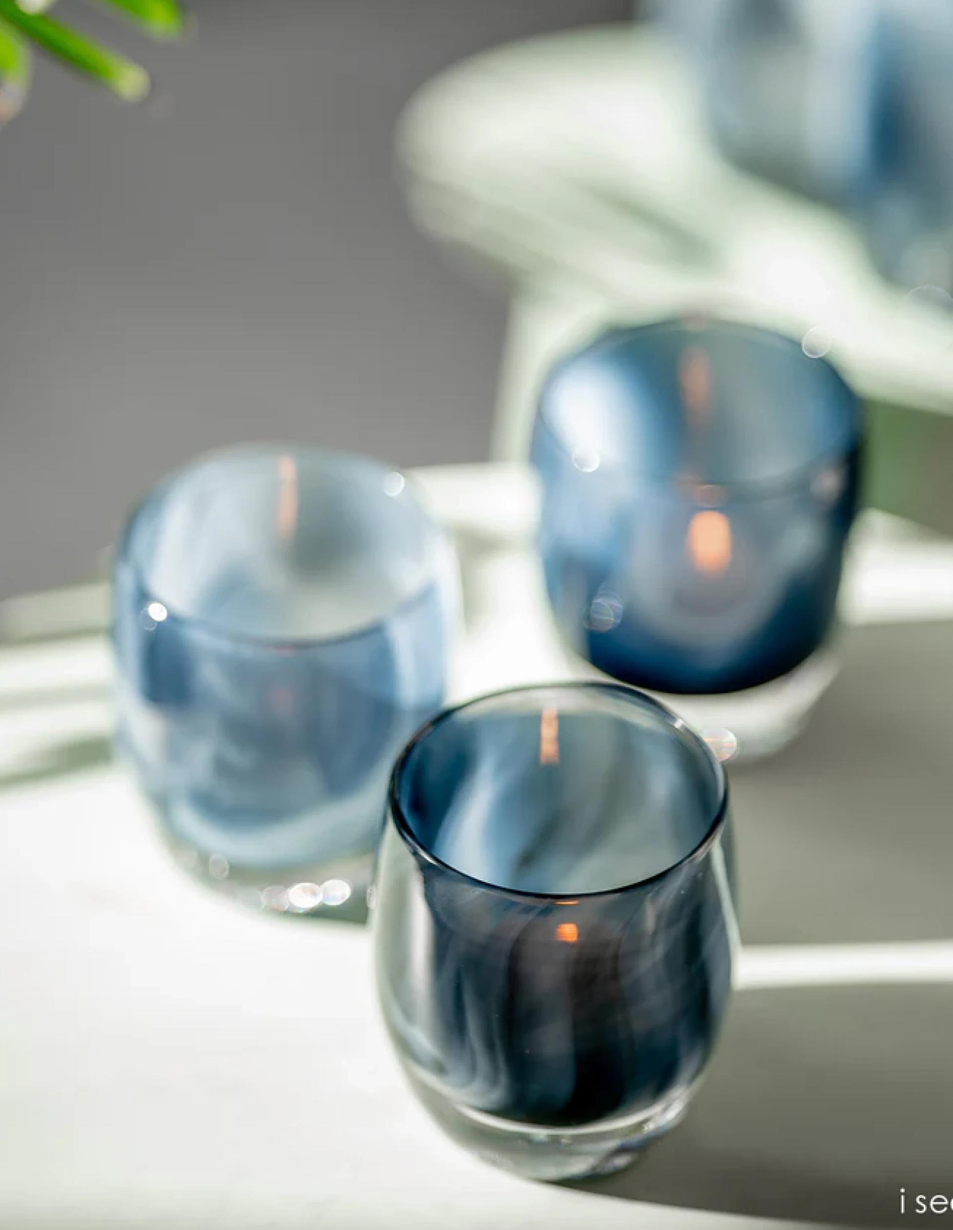 candles in glassybaby blue jars 