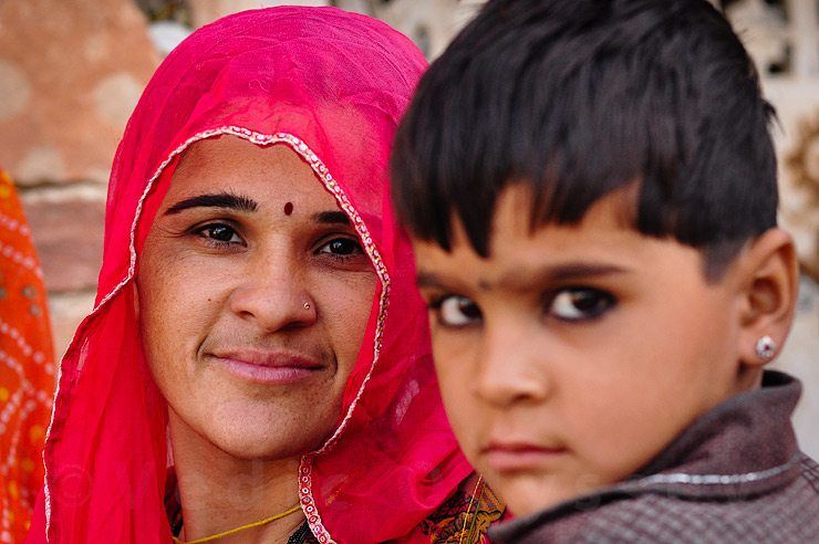 Indian woman carrying young boy