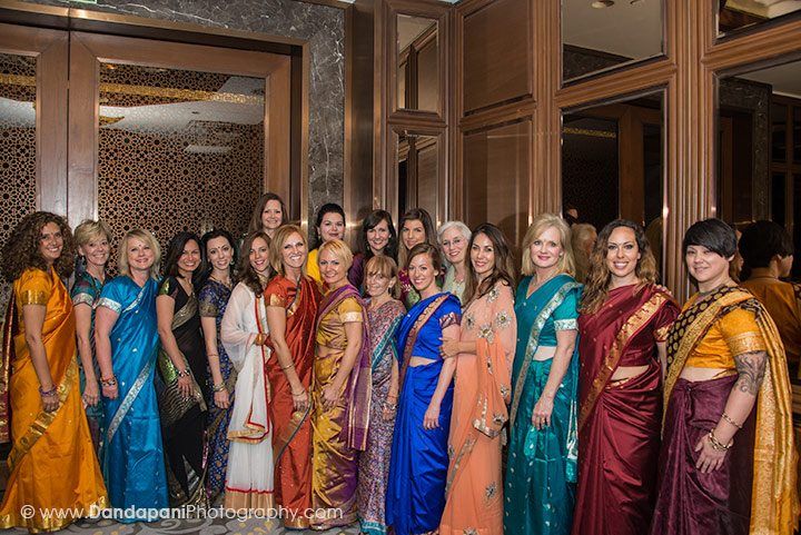 The ladies pose to display their beautiful saris and Indian dresses.