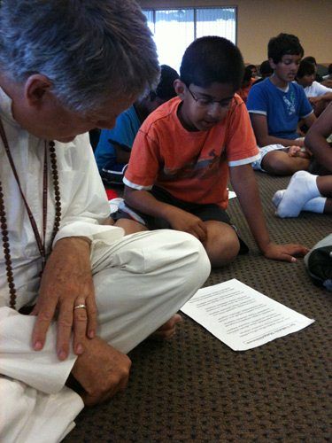 Easan, the other teacher at the camp besides me, joins the campers in the bhajans.