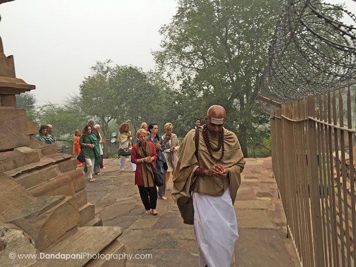 We each carry a coconut in our hands and walk around the temple three times.