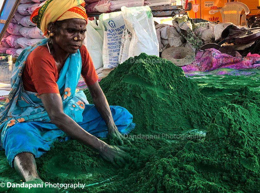 The colors are mixed thoroughly into the sand by hand.
