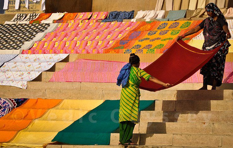 Indian women drying clothes on a river bank, Varanasi, India