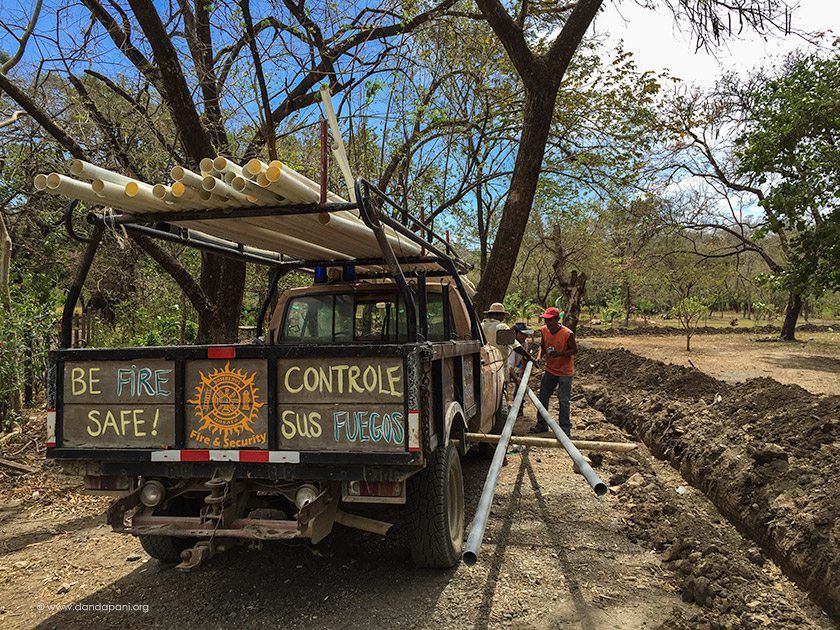 Our friend Joe, who is also the town's fireman, bring the fire truck to assist us to move all the pipes.