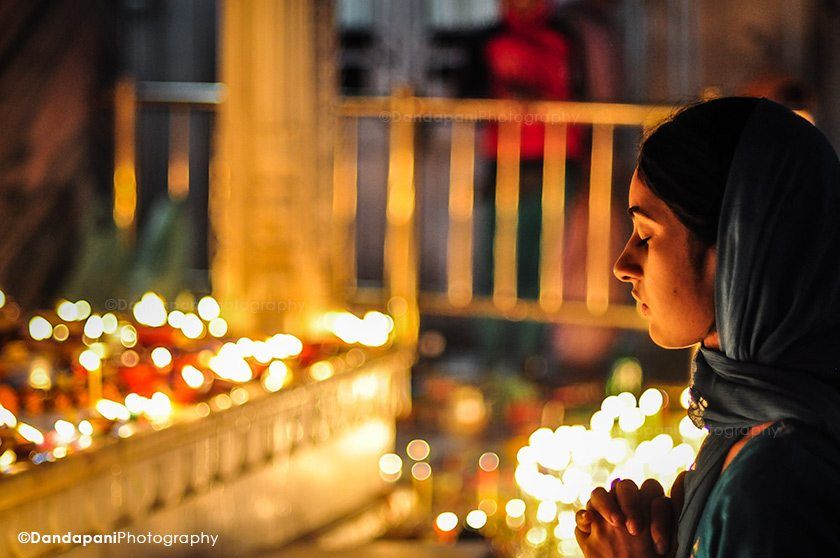Young and old pilgrims pray at the various shrines.