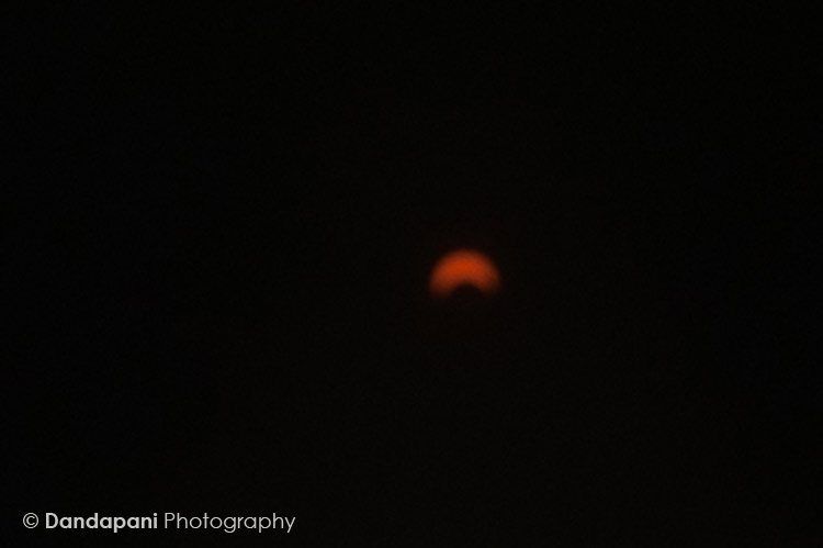 As were doing our morning practices on the beach a solar eclipse was taking place high above us. I borrowed a lady's solar viewing glasses and stuck my camera lens behind it to get this shot.