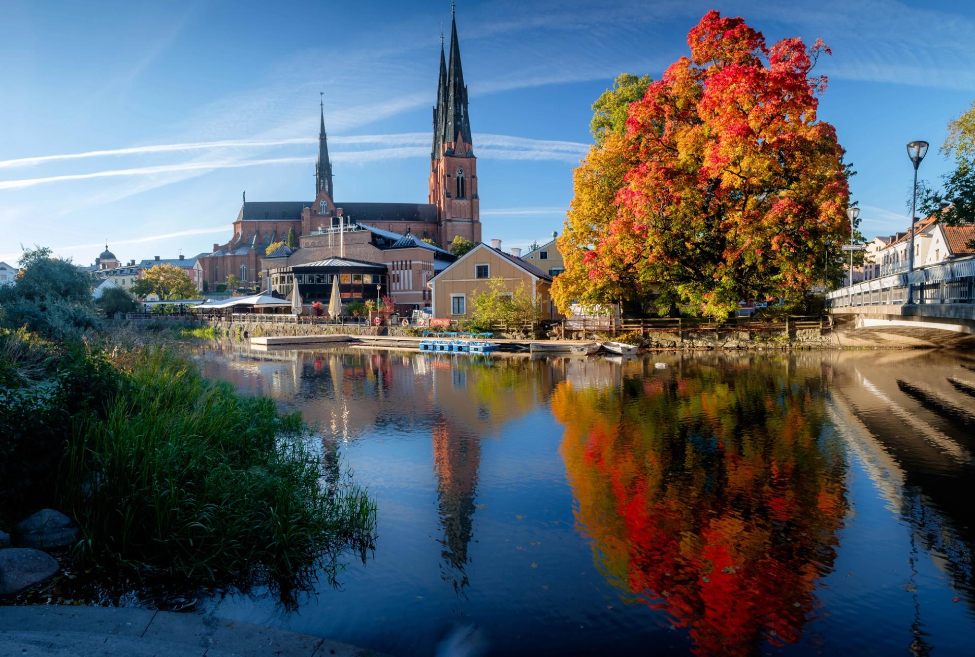 Uppsala Cathedral during autumn in the afternoon shot from across the water