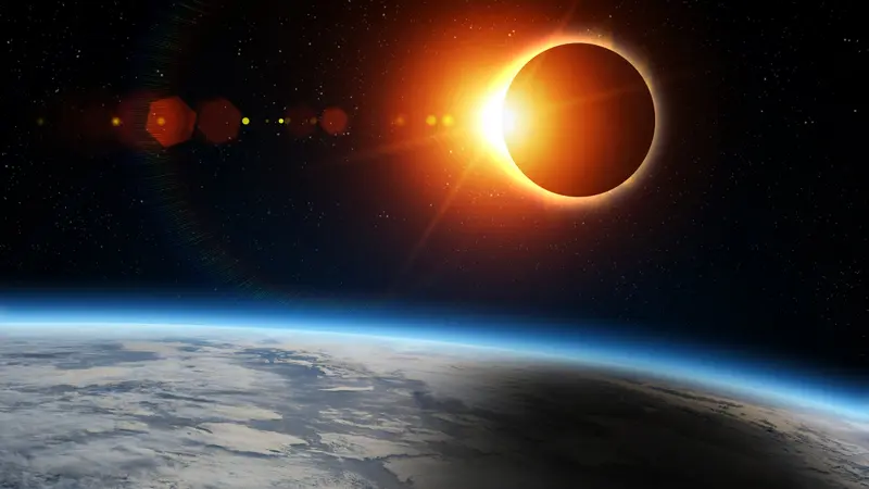 Totale Sonnenfinsternis über dem Erdhorizont aus dem Weltall gesehen
