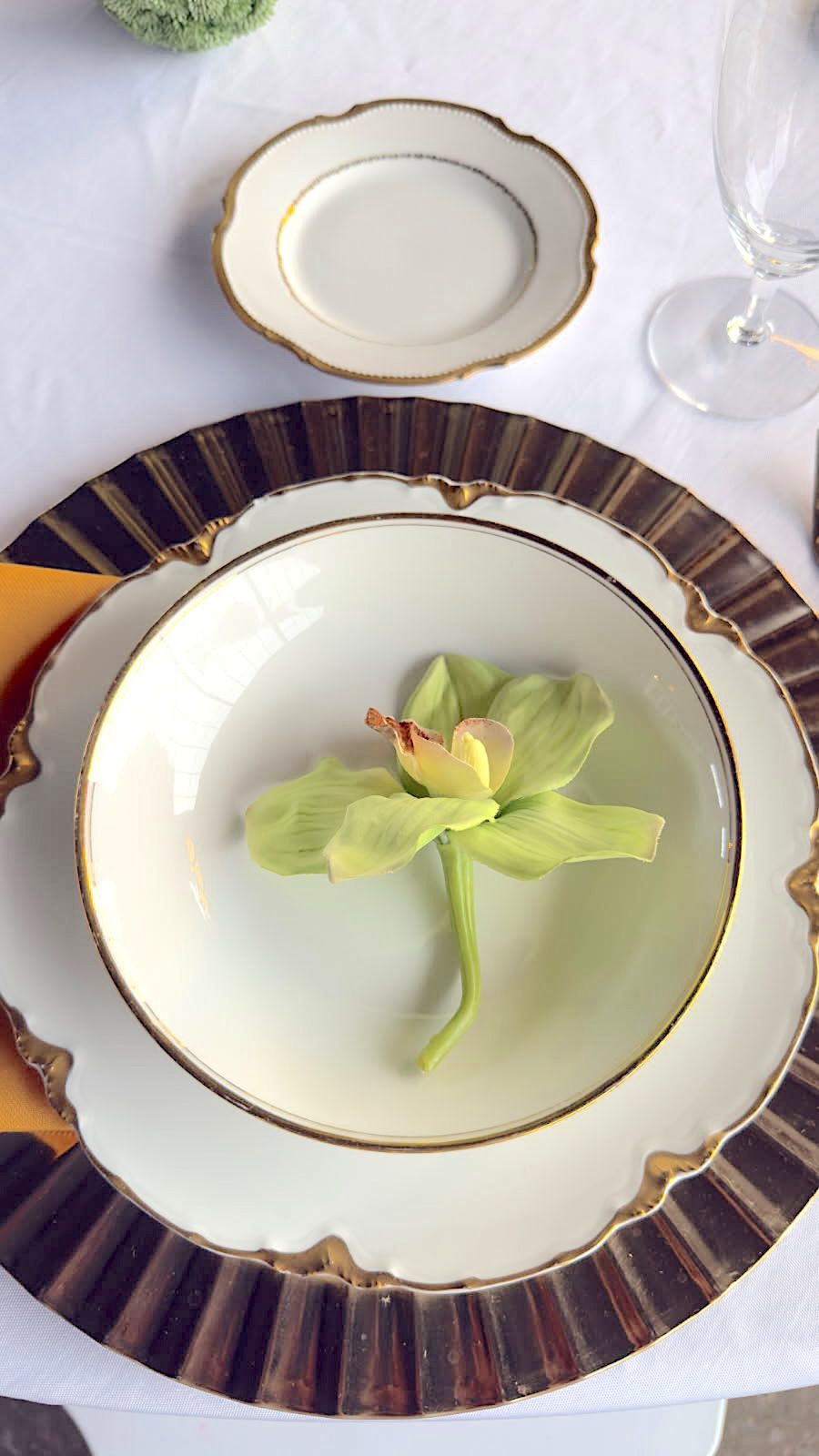Fine white and gold trimmed plates with graceful edging