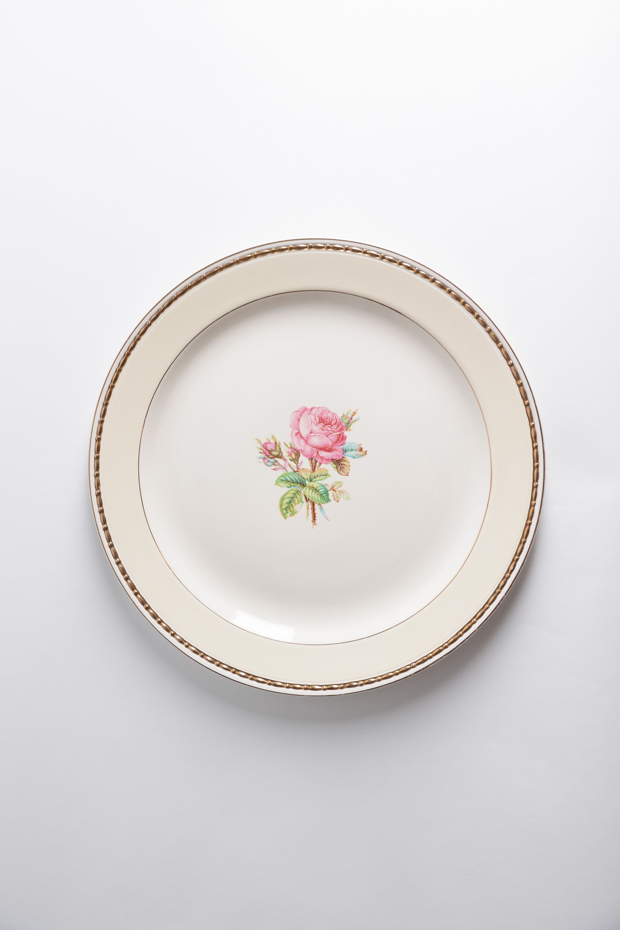 Round off-white vintage serving platter with hand-painted pink rose